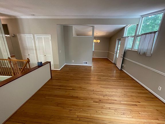 Living room, dining with deck to right