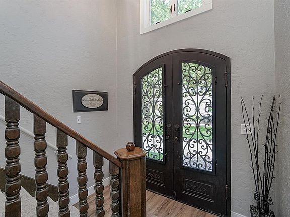Notice the detail work on the entry doors from this side