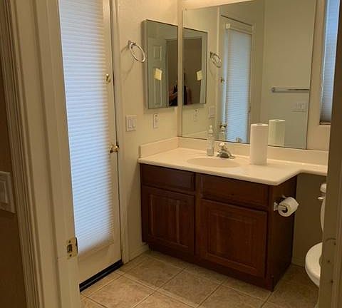 Downstairs Bathroom with access to pool/patio