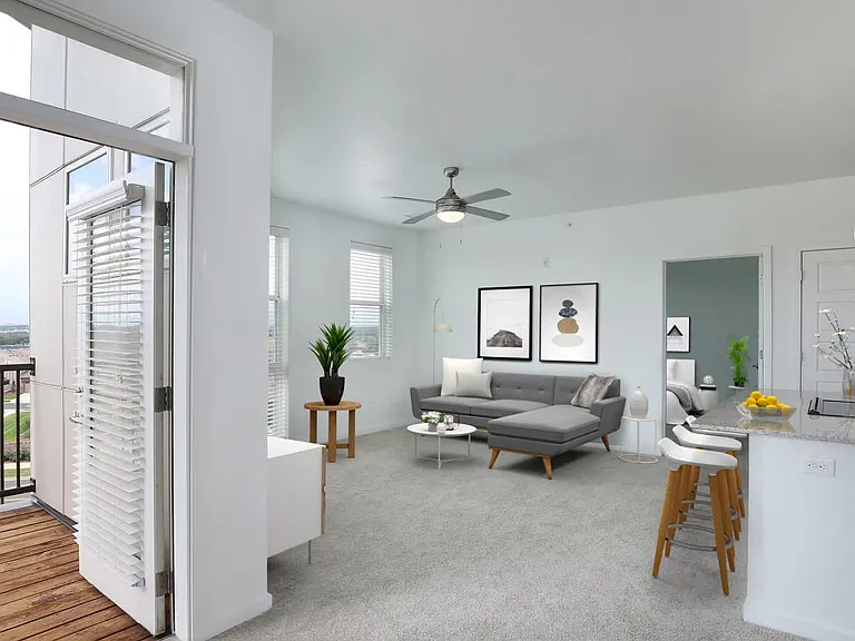 Carpeted Living Room and Balcony
