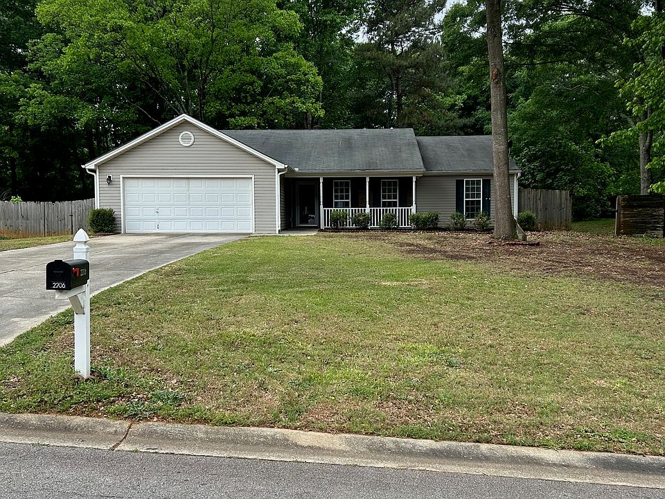 View of the house and level yard from the street