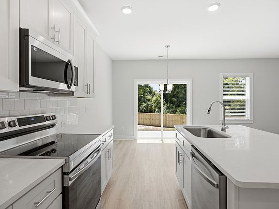 Kitchen View Towards Breakfast Area & Backdoors