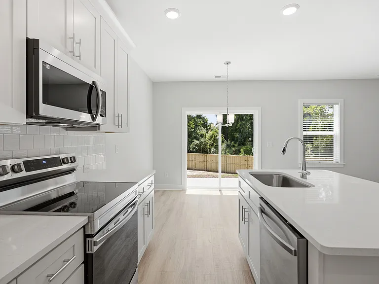 Kitchen View Towards Breakfast Area & Backdoors