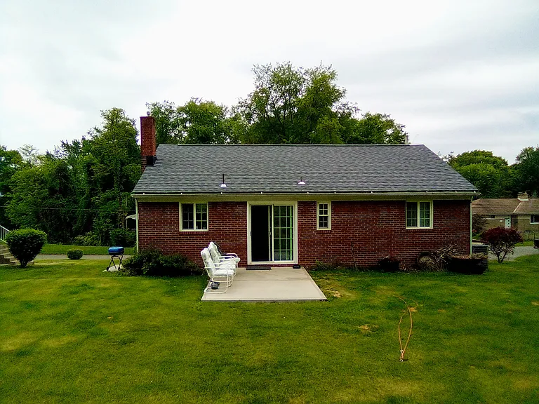 Back of house with patio off dining area