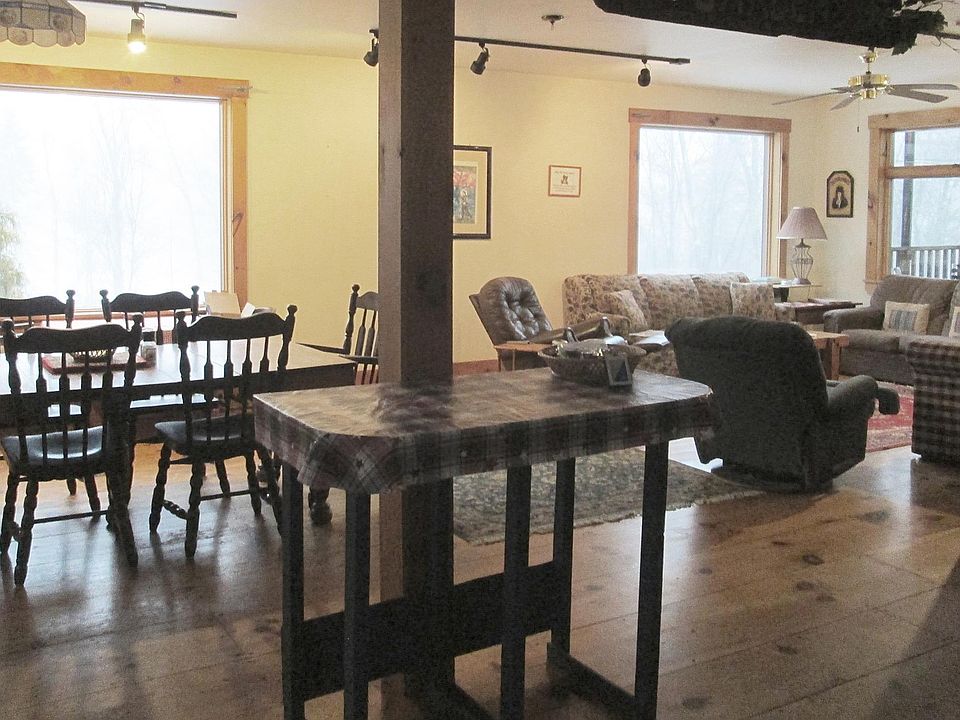 Great Room with large windows on a snowy day.