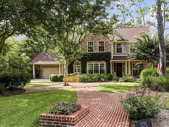 Beautiful traditional Hedwig Village home with brick facade and quaint front porch.