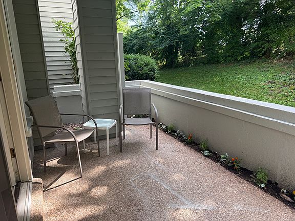Patio off of the dining room with newly planted flowers.