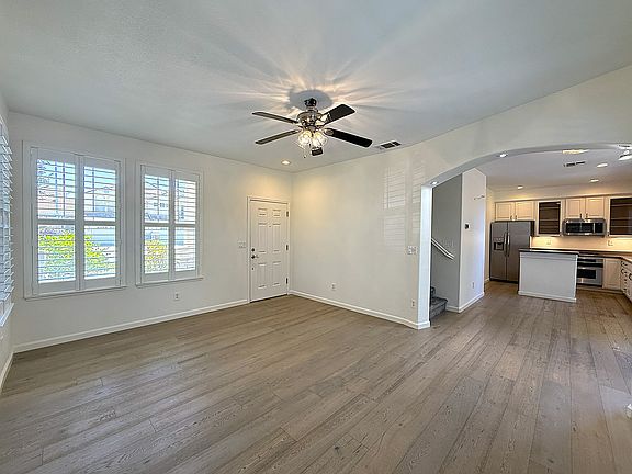 Family Room with Laminate Flooring & Plantation Shutters