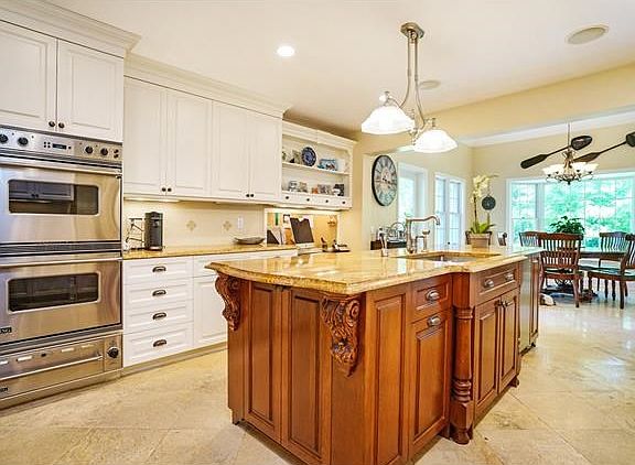 Cooking is a dream in the true "chef's" kitchen with Professional Viking appliances, including a 6-b
