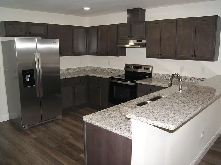 Large kitchen with plenty of cabinet space and counter tops