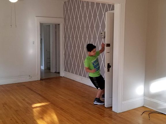View from living room into dining room and front entrance.