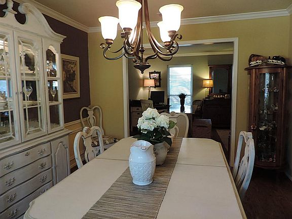 Formal dining area connects to the kitchen and has also just been painted two shades of neutral beige.