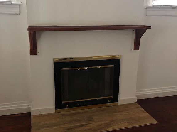 Wood burning fireplace in living room