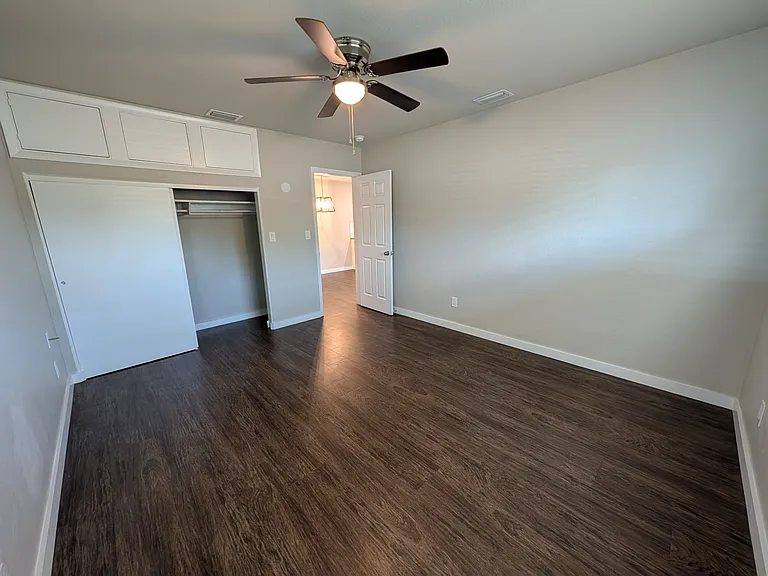 Large bedroom with additional storage above closet