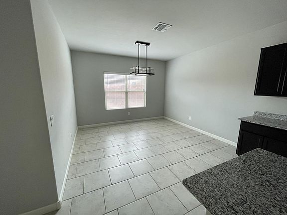 Dining Room with modern light fixture