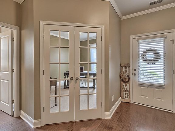 This multi purpose room has French Doors and can function as an office/study/music room/living room.