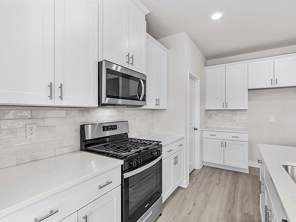 The well-appointed kitchen features plenty of counter space to make meal prep a breeze.