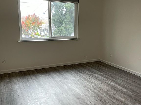 1st bedroom with new spc grey wood flooring.