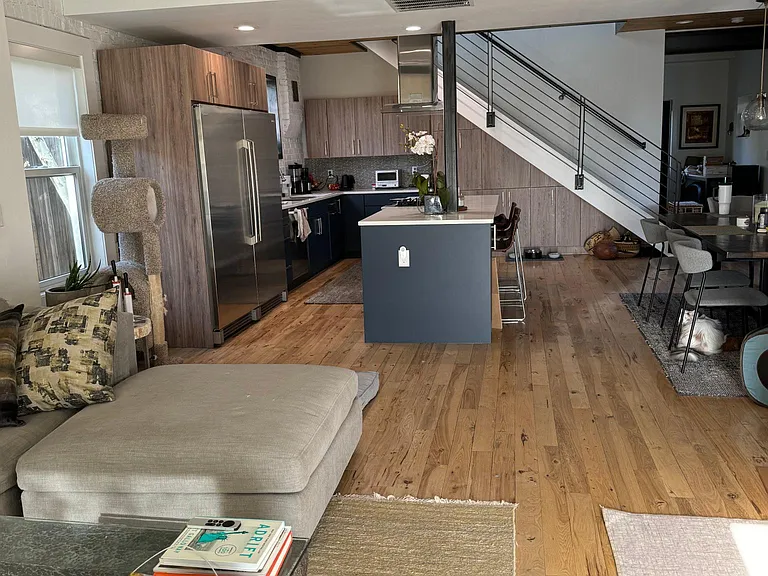near front entry, facing living room/kitchen/dining floor