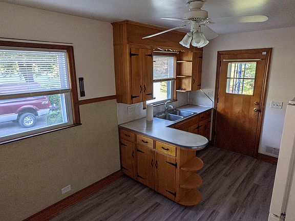 Kitchen window and sink view. Room for table and chairs.
