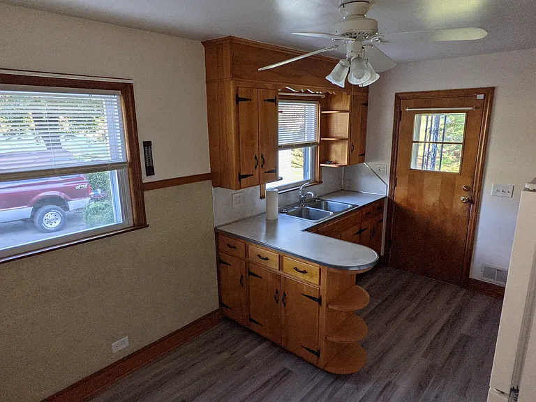 Kitchen window and sink view. Room for table and chairs.