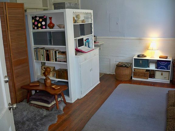 one room divided by bookshelves