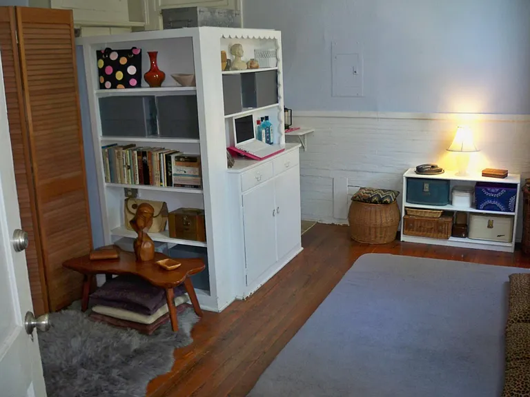 one room divided by bookshelves