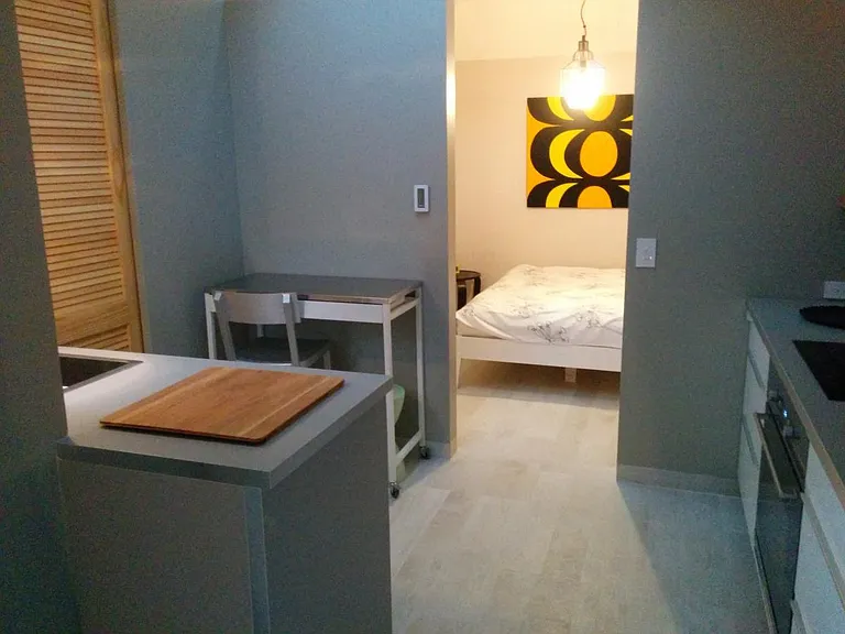 view of kitchen and bedroom from living room