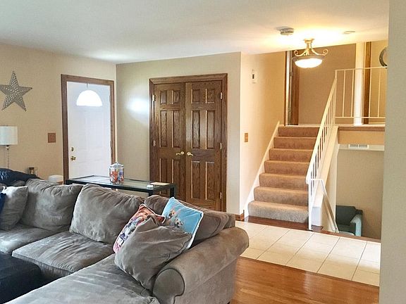 Foyer open to living room and dining room.