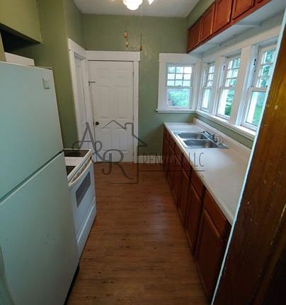 KITCHEN -- DOOR AT BACK OF ROOM GOES TO BACKYARD -- DOOR TO LEFT GOES TO BASEMENT.