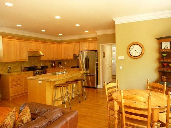 Gourmet kitchen opens to the family room and patio.