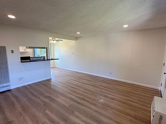 Living area and view of kitchen