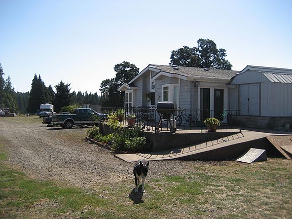 large concrete front patio with ramp access. Mt. Hood view from patio