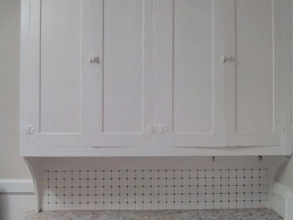 Kitchen with ceramic tile countertop on buffet