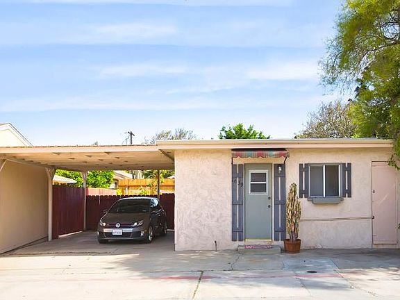 Covered parking for two cars with access to alley.