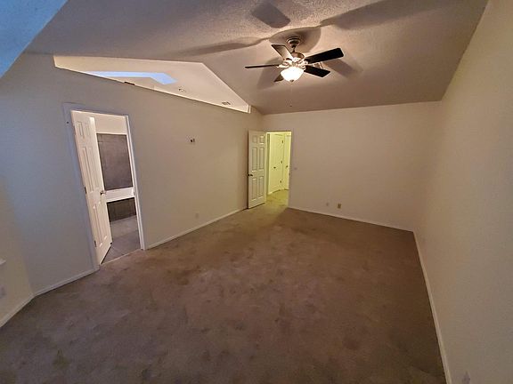 Master bedroom with vaulted ceiling