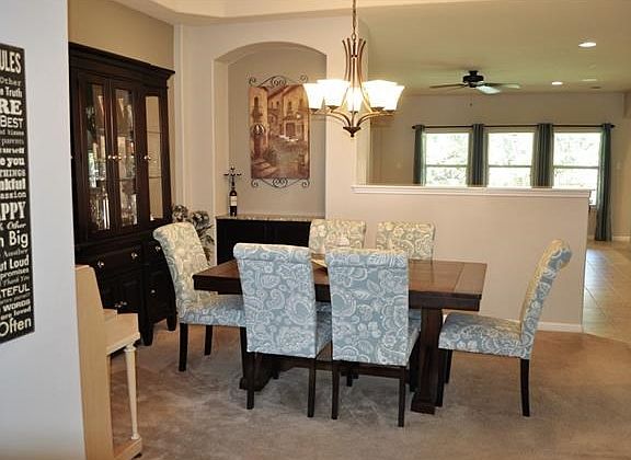 Formal Dining room with built-in, granite top buffet and open to Great Room and Kitchen.