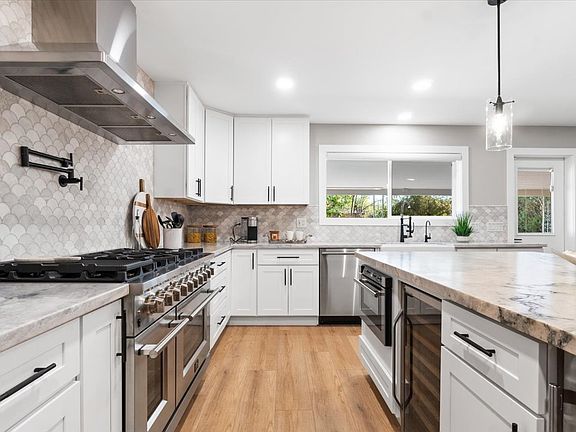 CHEF's KITCHEN w/ Oversized Island, and Wine Fridge