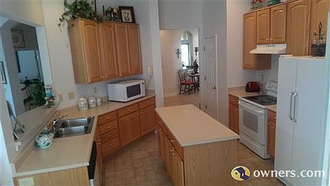 Kitchen has large island. Appliances stay.