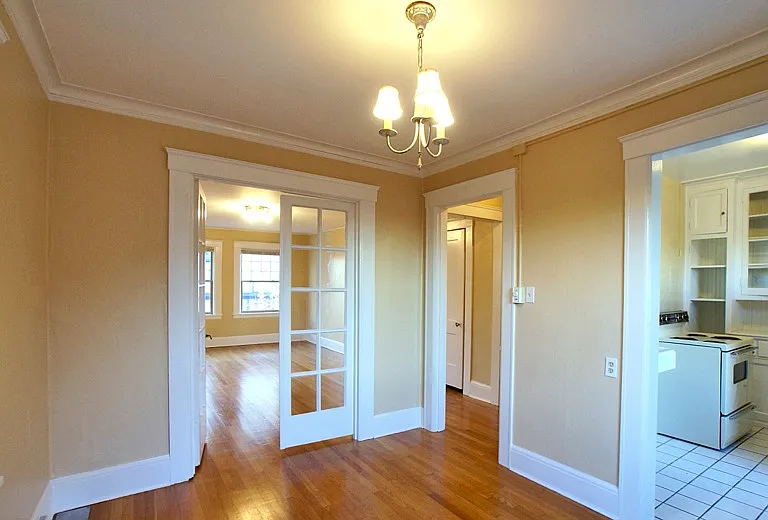French doors connect dining or home office space to living room and kitchen