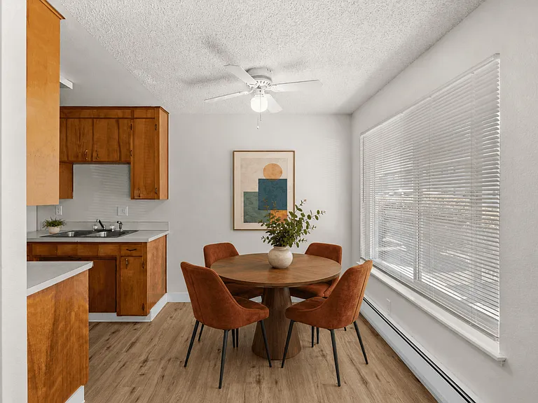 Bright dining area beside the kitchen in a one-bedroom deluxe apartment at Palisades Apartments in Tacoma, Washington.