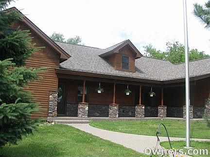 Spacious front porch w/brick pillars.
