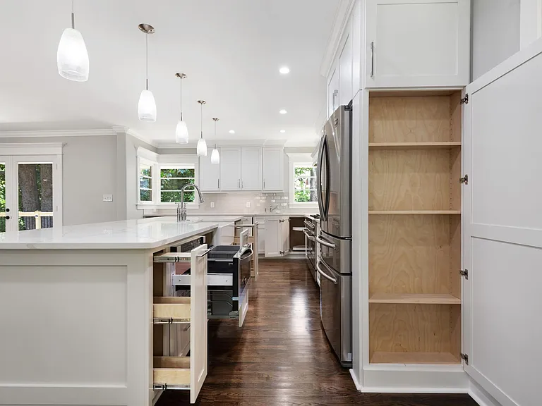 Custom cabinets contain utensil cabinet, spice rack cabinet, two separate trash drawers; one per sink, under cabinet lighting, lazy Susan, excess cabinets for storage and gourmet cooking! Brand new appliances. ZLine pro style gas range with double oven