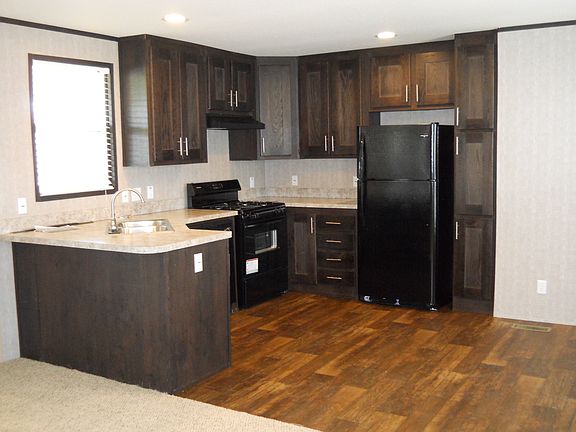 Kitchen has Shaker Cabinets that include a Tall Pantry Cabinet