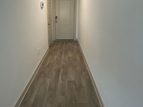 Front Door and Entry hallway with coat closet