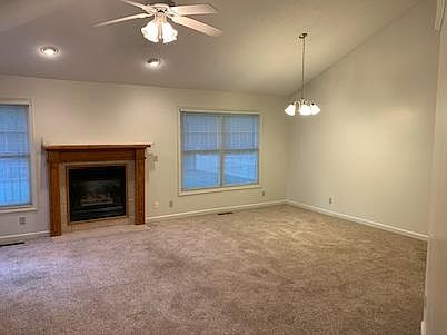 Living Room and Dining Room- Vaulted Ceiling and Fireplace