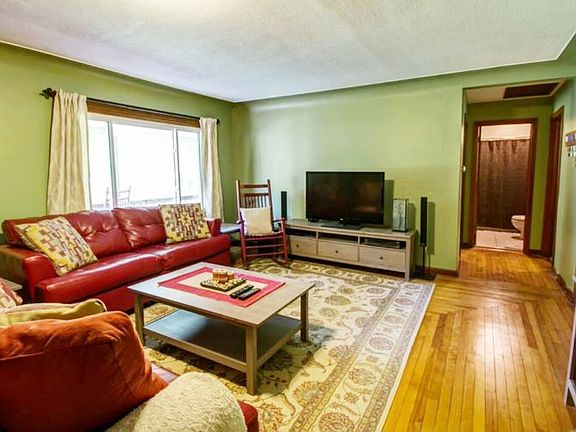 An additional view of the large living room as looking towards the main full bath and bedrooms.