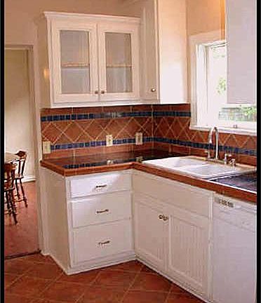 KITCHEN WITH TILE FLOORS, GRANITE COUNTERTOPS WITH TILE BACK