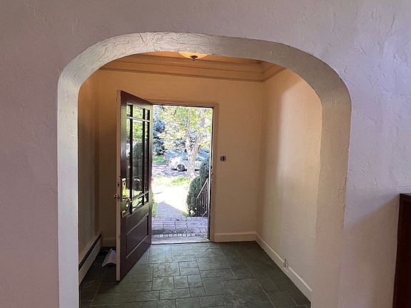 Entry foyer looking from living room thru front door to parkway