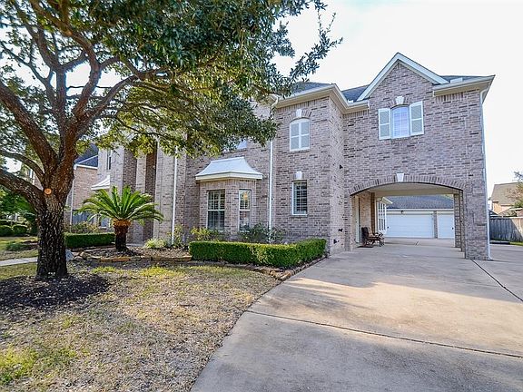 Elegant elevation, manicured landscape and mature trees add to the curb appeal.